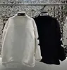 Otoño invierno engrosado abrigo de lana de cordero de piel sintética hombres y mujeres bordado de letras moda prendas de vestir exteriores chaqueta de lana cálida de gran tamaño suelta