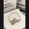 Designer Viviane Westwoods Vivienen High Version av Empress Dowager Vivienne Saturn Baroque Pearl Armband Nisch Temperament25555S