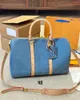 Designer Duffel Bags Womens Crossbody Bags 2024 Novo Mens Cruz Corpo Viagem Moda Denim Azul Esporte Ao Ar Livre Pacotes Clássico Travesseiro Bolsa Bolsas Totes