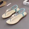 Sandaler kvinnor Summer Flat Heel Bohemian Pärled 2024 Est Ladies Fashion Elastic Band Open Toes Beach Shoes Black Beige