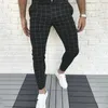 Pantaloni da uomo Uomo Quattro stagioni Moda Casual Plaid Stampato Tasca Cerniera Bottone Piedi Completo Corsa Allenamento Jogging Lungo