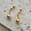 Brincos pendurados simples ins bolas douradas vintage designer elegante mulheres verão waterdrop clássico longo piercing