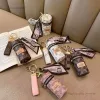 Desigenr Jewelry 2023 Fashion Perbyopic Keychain Cylinder Lipstick Bag Lipstick Pack Pack Earphone Storageミニコイン財布小さなポータブル