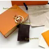 Klasynie smyczy designerka torba urok portfela brelokowe breyring mody torebka wisiork łańcuch samochodowy urok Brown Flower Mini Bag Torket Prezenty Akcesoria 2024