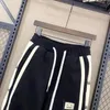 Mode coréenne imprimé Hip Hop taille élastique pantalon hommes Joggers Streetwear sarouel à revers cheville longueur pantalon hommes vêtements 240123