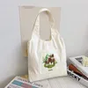 Kvällspåsar 2024 Kvinnor Canvas axelväska Student Tote Fashion Mushroom Print Handbag Korean version stor kapacitet shoppingväst