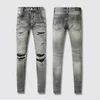 Designer jeans, mäns denim broderibyxor, fashionabla nödställda byxor, amerikanska storlekar 28-40 hiphop nödställda zipperade byxor amirs