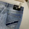 jeans da uomo di alta qualità firmati Jeans da uomo moda donna triangolo in metallo logo lettere pantaloni grafici ricamati pantaloni casual larghi slim a gamba piccola