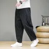Trendy w paski swobodne spodnie dla mężczyzn luźne bawełniane lniane spodnie w stylu chińskim dresami szerokokątne spodnie spodni 240126