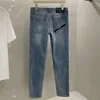 jeans da uomo di alta qualità firmati Jeans da uomo moda donna triangolo in metallo logo lettere pantaloni grafici ricamati pantaloni casual larghi slim a gamba piccola