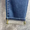 jeans da uomo di fascia alta firmati Jeans da uomo moda donna lettere verdi pantaloni grafici ricamati pantaloni classici larghi in vitello