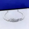 Bracciale Swarovski Designer Lusso Moda Donna Qualità originale Nuovi arrivi Personalizzato Piuma leggera Fibbia magnetica Romantica Perla piena di diamanti