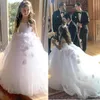 Robes de fille fleur blanche pour les mariages Spaghetti balayage Train dentelle fleurs faites à la main fête d'anniversaire enfant robes de première Communion