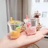 سلاسل المفاتيح العائمة لطيف البطيخ الخوخ مفتاح زجاجة أكريليك زجاجة نقل السائل Quickid و Fruit Key Chain Ring Women Bendant KE228Q