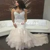 Underbar sjöjungfru Beige Country Wedding Dresses 2024 Sexiga remmar Ruffles Tiered Garden Bridal Dress Applicques Lace Sweep Train Romantic Robe de Mariee Chic Bride