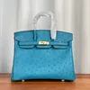 Vente en gros Top Original party Home sacs fourre-tout boutique en ligne Prix spécial peau d'autruche 25cm fil de cire cousu à la main sac à main pour femme bleu ont un vrai logo