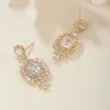 Orecchini pendenti che brillano gemme U CZ color oro 18 carati gioielli di moda per le donne