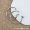 Boucles d'oreilles avec anneau de câble moyen du créateur David Yuman Jewelry, fil de bouton Pop