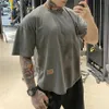 Camisetas para hombres 2021 Mens Muscle T Shirt Culturismo Fitness Hombres Tops Algodón Singlets Plus Tamaño grande Camiseta Algodón Malla suelta Manga corta