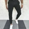 Pantalons pour hommes Hommes Quatre Saisons Mode Casual Plaid imprimé Poche Bouton de fermeture à glissière Pieds Sportswear en plein air surdimensionné