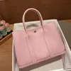 AABkin BKing Bolso de mano de diseñador Herrajes de cera de cuero original Bolso de jardín puro Hebilla de bloqueo con patrón de litchi 25 cm Bolso de mano con un solo hombro para mujer L98I