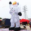 Actividades al aire libre 10 mH (33 pies) con soplador astronauta inflable gigante con luz LED Gran publicidad astronauta dibujos animados en venta