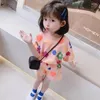 衣類セットベビーガールズ衣服韓国の子供の花短袖Tシャツショーツ2PCSスーツジュニアトップアンドボトムセット服装ラウンジウェア