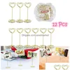 Décoration de fête Omz 12pcs Forme de coeur d'or Porte-po Stands Porte-numéros de table Clips de menu en papier pour les mariages Drop Livraison Dhvwd