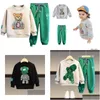 Ensembles de vêtements Automne Bébé Fille Garçon Vêtements Ensemble Enfants Sports Dessin Animé Ours Sweat Haut Et Pantalon Bouton Deux Pièces Costume Coton Tra Dhkai