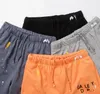 Nouveaux hommes à l'encre mouchetée Shorts d'impression Impression de crampons de conception de maille de conception polyvalente Couleur solide décontractée pour hommes et femmes départements