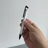 Toptan süblimasyon metal pürüzsüz yazma kalemleri beyaz alüminyum gövde diy zanaat telefon standı, özelleştirilmiş hediyeler için büzülme sargısı ile tükenmiş kalem