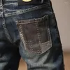 Jeans da uomo con cuciture design personalizzato elasticizzato dritto stile americano tendenza pantaloni da moto attillati con toppe strappate irregolari