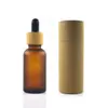 Bottiglia di vetro ambrato smerigliato da 100 pezzi da 30 ml con tappo in bambù con contagocce in scala di imballaggio in tubo di carta2061
