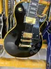 Custom electric guitar, black casting, yellow logo and body binding, gold accessories