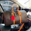 Marca de moda Bolsas de lona de mano Bolso cruzado Mochila Nuevo Equipaje de un solo hombro para hombres y mujeres Almacenamiento de gran capacidad para viajes de negocios Bolsa de ejercicios