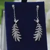 Designer de luxe asiatique or et argent aiguille boucles d'oreilles célèbre marque française classique plume creuse plaqué or 18 carats femmes charme bijoux fille cadeau de mode