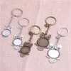 Porte-clés 5pcs / lot porte-clés en métal rond hibou cabochon réglage bricolage vintage fabrication de bijoux faits à la main