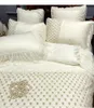 Set di biancheria da letto Biancheria da letto stagionale di lusso in pizzo leggero stile principessa Gongsatin in puro cotone gonna a quattro pezzi copripiumino.