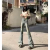 Zhi Orange # Jeans svasati micro con doppio bottone dal design retrò per donna con vita alta, vestibilità slim e tendenza dei pantaloni svasati di alta personalità