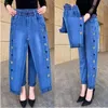 Jeans pour femmes printemps été couleur unie mode femmes haute rue poches décontractées brodées taille élastique tout-match haren pantalon