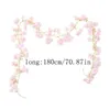 Corona di fiori di ciliegio artificiali lunga 180 cm decorata con archi per feste di matrimonio in rilievo disposti con viti di fiori di seta rosa 240131