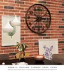 壁の時計クリエイティブ自転車の車輪ハンギングアイアンアート工業用装飾と時計