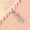 Keychains 20pcs Fashion Keychain 26x17mm Cheerleaders Cheering Dance Pendants DIY Men Jewelry Car Key Chain Ring Holder Souvenir For Gift