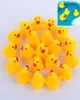 100 pcs/lot Mini canards en caoutchouc jaune bébé bain eau canard jouet sons enfants bain petit canard jouet natation plage cadeaux 6683657