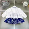 Moda Kids Dress Sets Roupos de trilhas para crianças de alta qualidade Roupas meninas Tamanho 110-160 Camisa branca de mangas compridas e saia curta azul 24FeB20