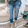 Kvinnors jeansbyxor för damer denim byxor kvinnor trycker rippad plus storlek med fickor veterement femme