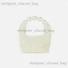 Axelväskor 2023 Summer Womens Artificial Pearl Handbags Fashion Handwoven Pärlad middagsväska Lyxig designer Bag Högkvalitativ T240301