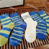 Chaussettes imprimées de lettres de mode, chaussettes décontractées pour hommes et femmes, cinq paires de chaussettes en coton de styliste, chaussettes de couleur unie