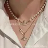 Diseñador VivieneWestwoods Emperatriz Viuda Saturno Collar de Perlas Pin Femenino Estereoscópico Planeta Cadena para el Cuello Luz de Gama Alta Lujo Pequeño y Popular Ouyang Nana Mismo