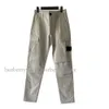 Tasarımcılar Kargo Pantolon Topstoney Gevşek Cep İşlemeli Rozet Pantolon İnce Günlük Boyut M-2XL 2024 Bahar Erkekler Joggers Pants